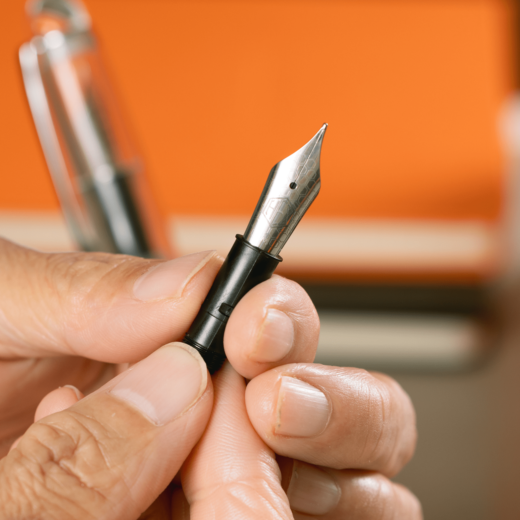 Hex Pens nib unit held in hand, by Hex Pens.