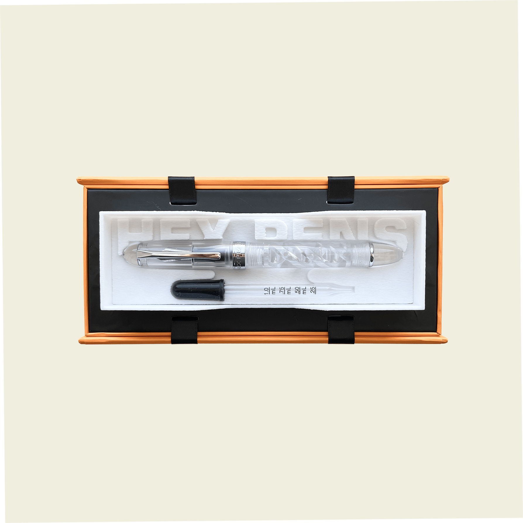 Uninked DNA Lucent fountain pen with an eyedropper placed inside the packaging box, by Hex Pens.