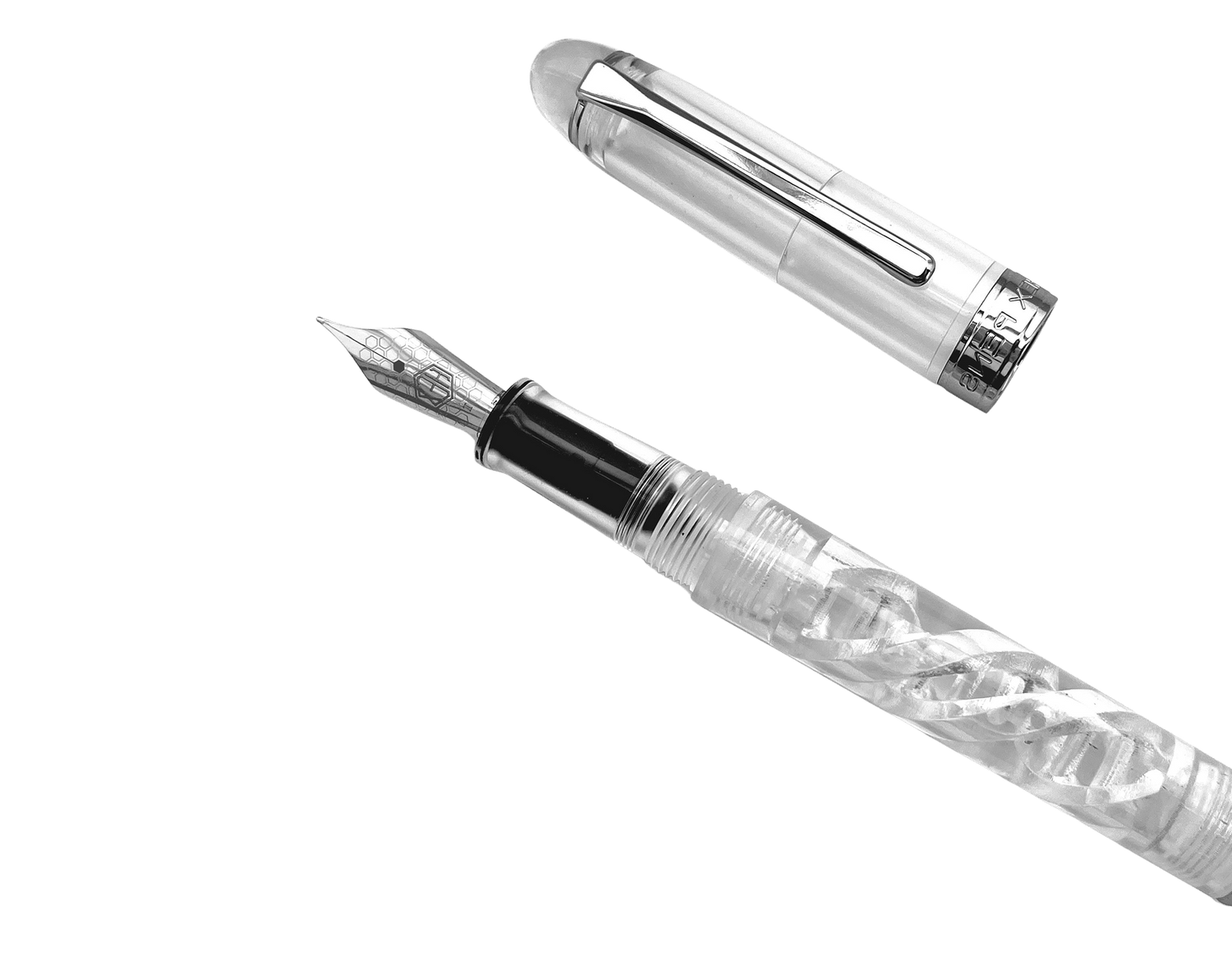 Uninked DNA Lucent fountain pen uncapped, placed diagonally with the cap on the side and the end cap cropped off, by Hex Pens.