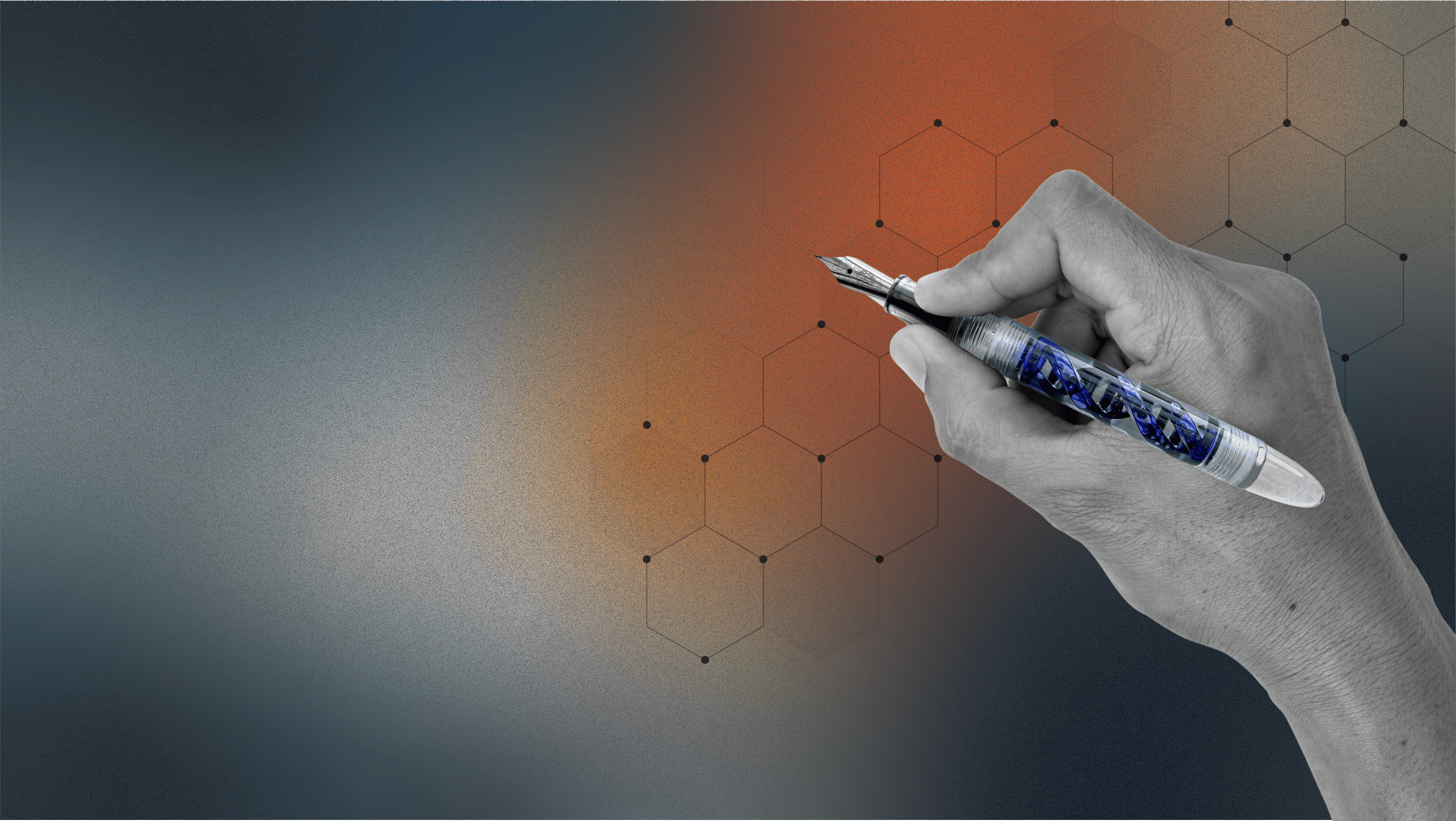 Hand holding inked DNA Lucent fountain pen over hexagonal elements on a black, white, and orange blurry gradient background, by Hex Pens.