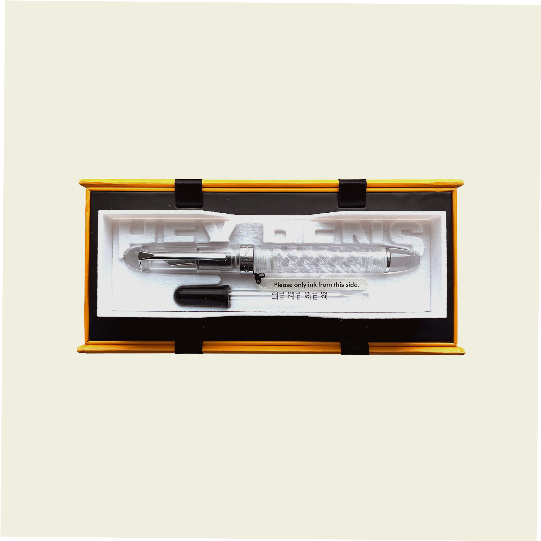 Uninked Triple Twist Lucent fountain pen with an eyedropper inside the packaging box, by Hex Pens.